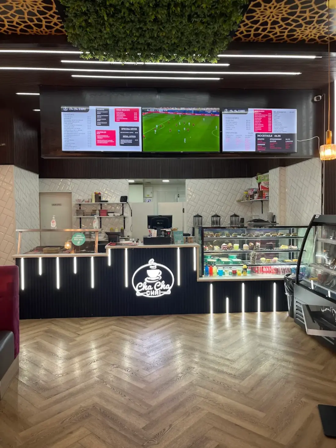 The counter, menu screens overhead and the dessert display cabinet